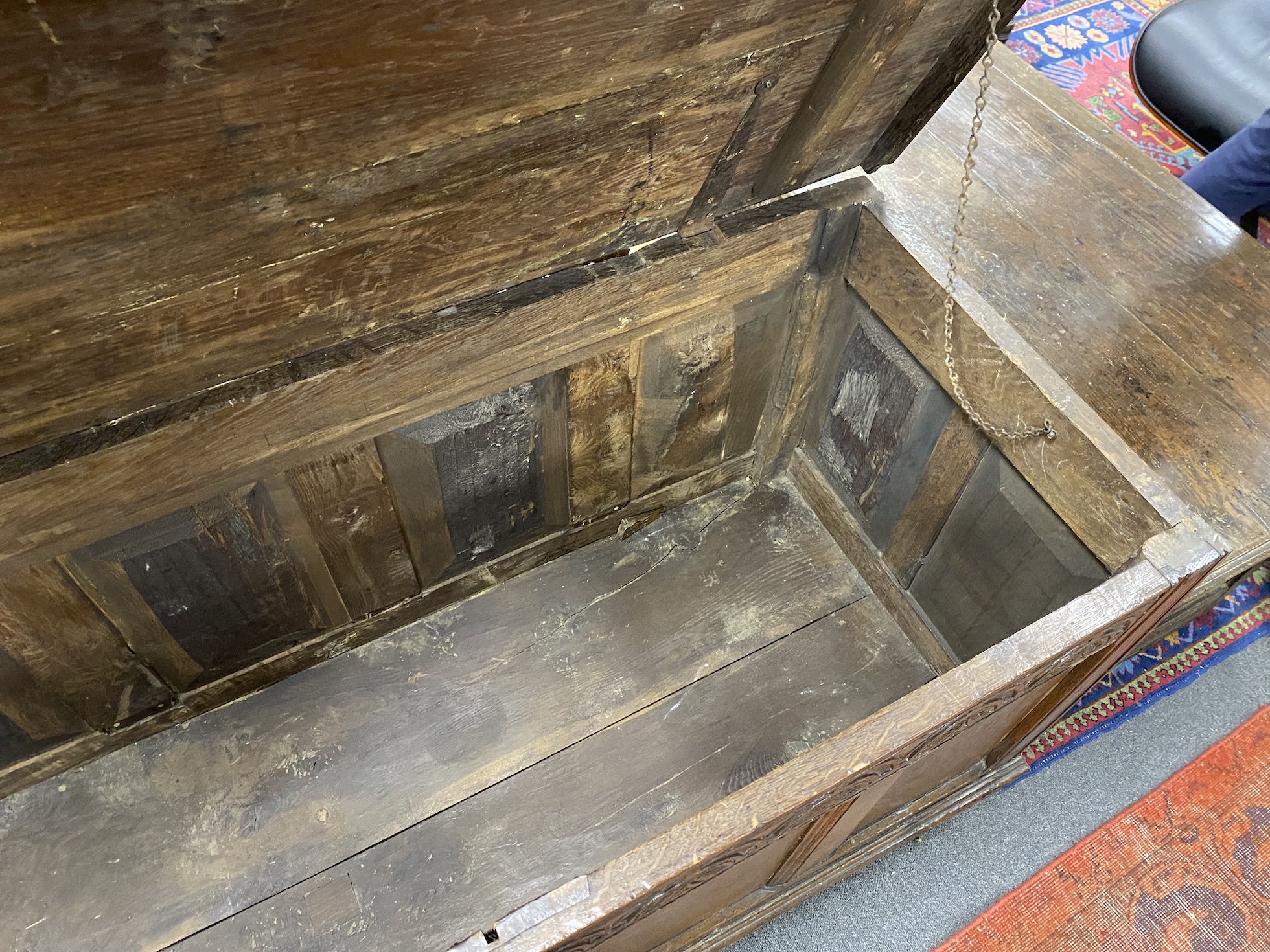 An 18th century panelled oak coffer (sun bleached top), length 147cm, depth 62cm, height 73cm